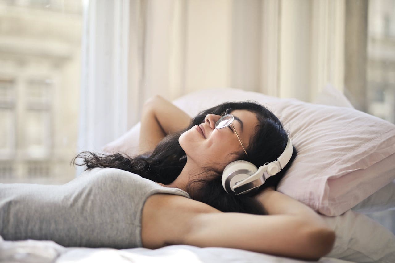Woman relaxing in bedroom